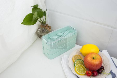 Photo for Colored plastic lunchboxes on the table - Royalty Free Image
