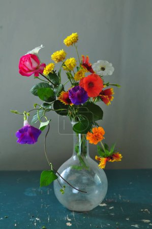 Beautiful bouquet of summer flowers in a glass vase