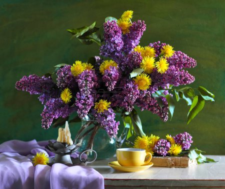 Beautiful bouquet of lilac on a wooden background