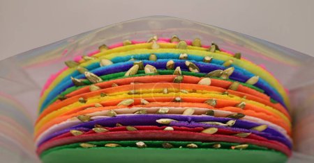 Colorful mexican sweets, pepitorias, in plastic box, horizontal.