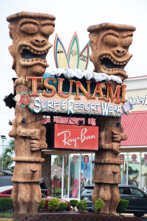 Photo for Myrtle Beach, South Carolina, United States, May 27, 2023: sign for Tsunami Surf Shop No. 7 beachwear store beach shopping surf and lifestyle apparel and gear, beach accessories - Royalty Free Image