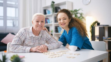 Photo for Portrait of a nurse and senior woman in a retirement home, elderly home care - Royalty Free Image