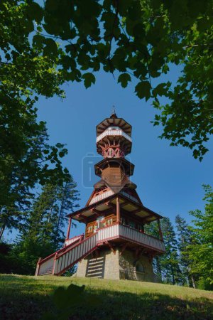 Photo for Jurkovic lookout tower in National Open Air Museum, Roznov pod Radhostem, Czech republic. Touristic Watchtower designed by famous Slovak architect Dusan Jurkovic. Popular touristic point of the region. - Royalty Free Image