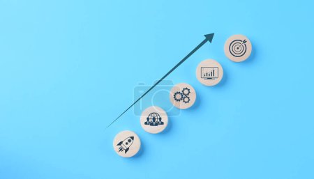 Photo for Strategic business growth and success path concept. Strategic growth path with icons representing teamwork, innovation, and target achievement on a blue background. planning strategy, investment goals - Royalty Free Image