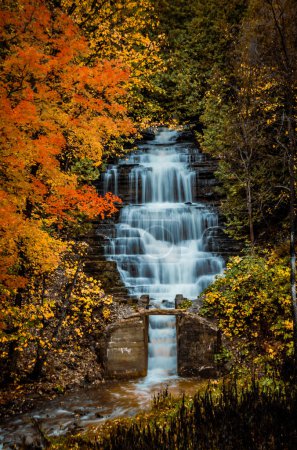 Waterfall in the fall in Orleans, Ottawa, Ontario, Canada. Photo taken in October 2021. 