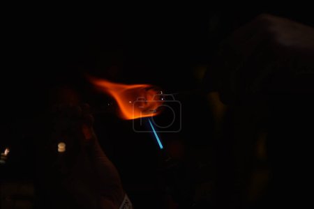 Photo for Glass blowing process in the dark - Royalty Free Image