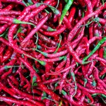 Close-up View Of Fresh Red Chilies On A Local Market Table