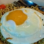 Close Up View Of Indomie Fried Noodles (Fried Noodles) With Sunny Side Up Egg