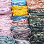 Various Kinds Of Colorful Fabrics Arranged Tightly And Neatly