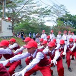 MUNTOK,INDONESIA - SEPTEMBER 10, 2023 : Competition Attraction For Junior High School Students Walking Competition, Red And White Costumes