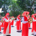 MUNTOK,INDONESIA - SEPTEMBER 10, 2023 : Female Carnival Participants In Red And White Costumes And Using Tambourine Musical Instruments, At The Carnival Celebrating Indonesian Independence Day