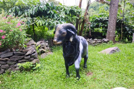 a black white goat statue in taman kemesraan