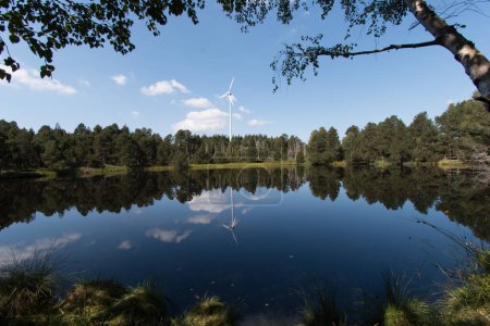 Photo for Windenergie trifft Naturschutzgebiet in toller Landschaft und einem See - Royalty Free Image