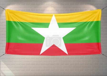 Myanmar (Burma) national flag cloth fabric waving on beautiful bricks Background.