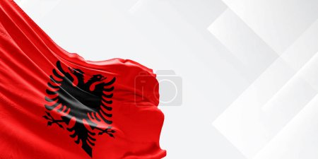 Albania national flag cloth fabric waving on beautiful white Background.