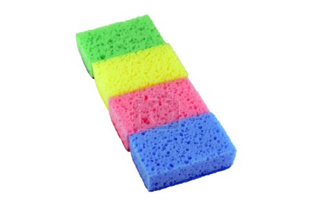 Photo for A group of new washing sponges (yellow, green pink and blue) lying in a row (line), isolated - Royalty Free Image