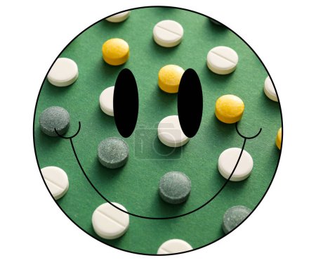 Schwarzes Lächeln, gefüllt mit gelben und grünen Pillen (Kapseln) auf weißem Hintergrund