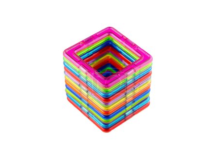 A group of colorful transparent magnet squares (puzzle constructor game for kids) connected into a tunnel on a white background