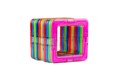 A group of colorful transparent magnet squares (puzzle constructor game for kids) connected into a tunnel on a white background