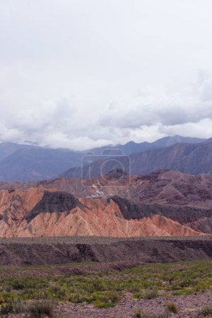 Photo for High in the cordillera. View of the colorful rock and sandstone cliffs. The arid desert orange and brown mountains in Tilcara, Jujuy, Argentina. - Royalty Free Image