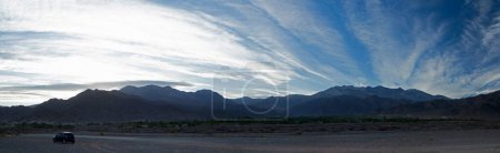 Photo for Panorama view of beautiful mountains under scenic blue sky with clouds. - Royalty Free Image