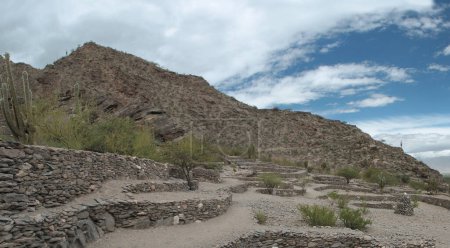 Photo for Archaeology and heritage. Panorama view of the city ruins. Fortress made of stone in the mountains and desert. - Royalty Free Image