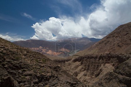 Photo for Altiplano. High in the Andes mountains. View of the arid sandstone formations, rocky mountains, cliffs and ravine under a beautiful sky. - Royalty Free Image