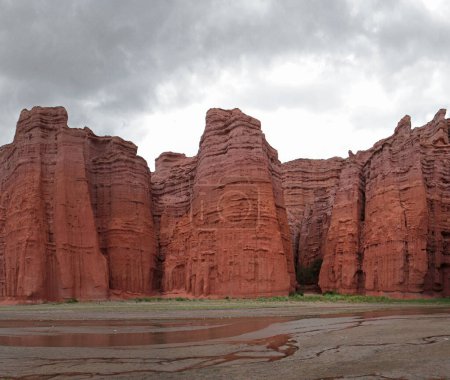Photo for The canyon red cliffs and lake. Panorama view of the popular red sandstone and rocky formation called The Castles in Salta, Argentina. - Royalty Free Image