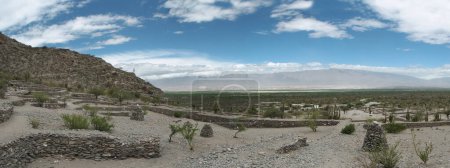 Photo for Archaeology and heritage. Panorama view of the city ruins. Fortress made of stone in the mountains and desert. - Royalty Free Image