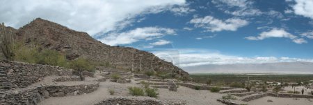 Photo for Archaeology and heritage. Panorama view of the city ruins of the Quilmes aboriginal civilization with Inca influence. Fortress made of stone in the mountains and desert. - Royalty Free Image