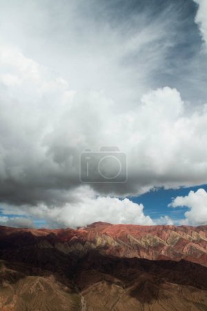 Photo for Aerial view of the colorful mountain under a dramatic cloudy sky. Beautiful rock and clouds texture and pattern. - Royalty Free Image
