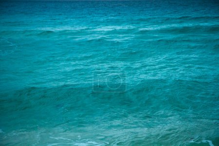 Photo for Natural water texture. Turquoise color water ocean and sea waves in the Caribbean. Relaxing pattern and tones. - Royalty Free Image