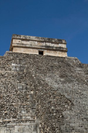 Photo for Travel. Ancient Maya civilization and architecture. Closeup of the apex of the mayan stone pyramid temple Kukulkan of Chichen Itza ruins in Yucatan, Mexico. - Royalty Free Image