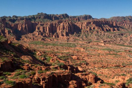 Desert landscape. View of the red canyon, sandstone and rocky mountains, under a blue sky. 