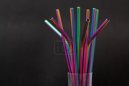 Photo for Colorful reusable metal straws on dark background. Zero plastic concept. - Royalty Free Image