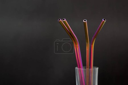Photo for Colorful reusable metal straws on dark background. Zero plastic concept. - Royalty Free Image