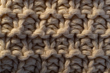 Photo for Macro view of the fabric of a garment. Texture of fabric with warm illumination - Royalty Free Image