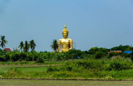 Photo for Great Buddha Statue, with rice field in foreground. Ang Thong province, Thailand - Royalty Free Image