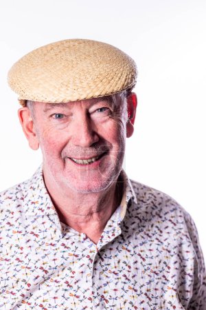 This image captures a cheerful senior man wearing a classic straw boater hat, exuding a sense of summer ease and contentment. His warm, friendly smile and twinkling eyes project a welcoming and jovial