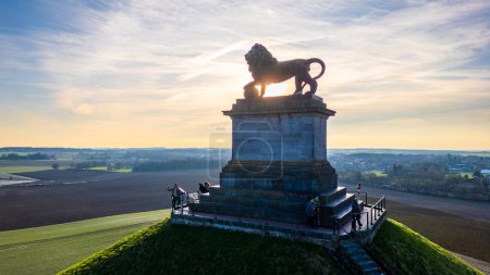 Photo for Waterloo, Brussels, Belgium, February 25th, 2024, The image features the iconic Lion Statue at the Waterloo Battlefield memorial site during dusk. The statue is positioned against the backdrop of a - Royalty Free Image