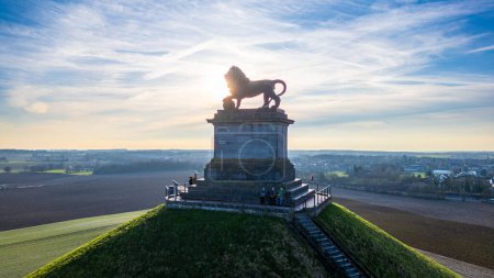 Photo for Waterloo, Brussels, Belgium, February 25th, 2024, This image captures the Lion Statue at the Waterloo battlefield memorial bathed in the soft light of the morning sun. The statue is perched atop a - Royalty Free Image