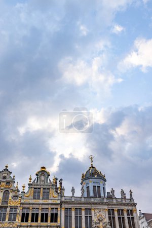 Photo for BRUSSELS, BELGIUM, June 23, 2023: The historic Maison du Roi, with its opulent gilded facade and ornate sculptures, stands under a dramatic cloudy sky in Brussels Grand Place. Grandeur of the Gilded - Royalty Free Image