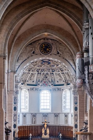 Trier, Rijnland-Palts, Germany, 23th of March, 2024, The Trier Cathedrals interior stands out with its detailed artwork, grand arches, and religious iconography. The central window pours light onto