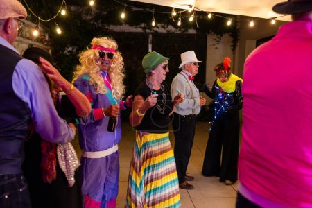 Group of adults in playful costumes enjoying a lively, vibrant themed party with festive atmosphere.