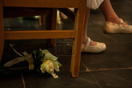A photo captured a brides dropped bouquet and shoes during a reflective moment before her wedding ceremony