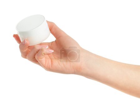 Frasco de crema cosmética de mano femenina