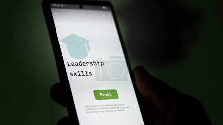28th August 2023. A student holds a phone, enrolls in courses to study leadership skills program, learn new skill and pass certification. Text in English, English text.