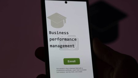 Photo for A student holds a phone, enrolls in courses to study business performance management program, learn new skill and pass certification. Text in English, English text. - Royalty Free Image