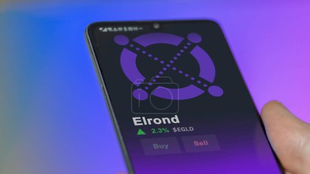 Photo for September 19th 2023. An investor analyzing the price of elrond, the crypto $EGLD broke out above the limit, EGLD and climbs above the price. - Royalty Free Image