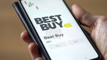 Photo for The logo of Best Buy on the screen of an exchange. Best Buy price stocks, $BBY on a device. - Royalty Free Image